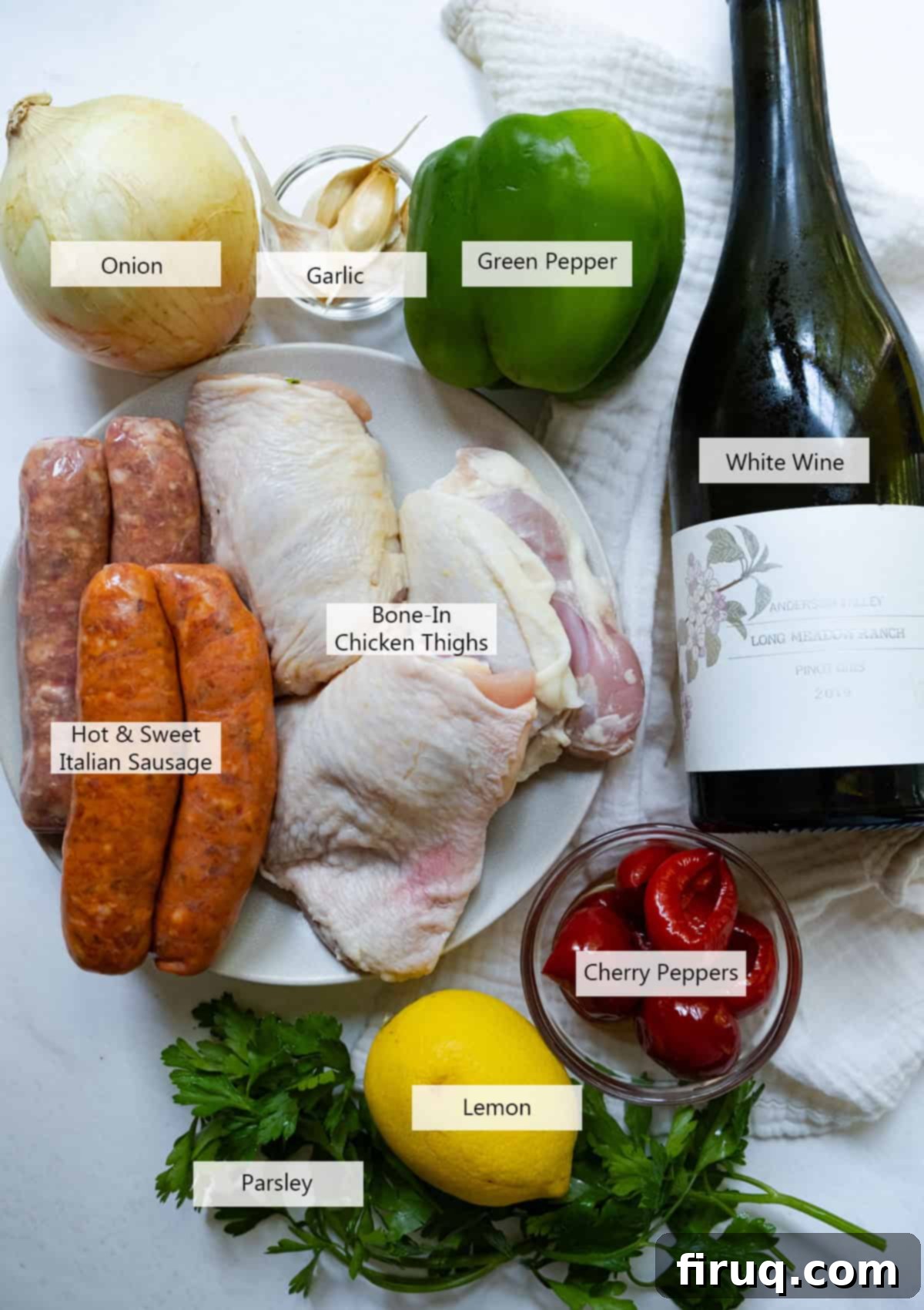 Zesty Italian Chicken Scarpariello 3 Selection of ingredients for Chicken Scarpariello, including chicken thighs, sausages, peppers, onion, garlic, wine, and herbs.