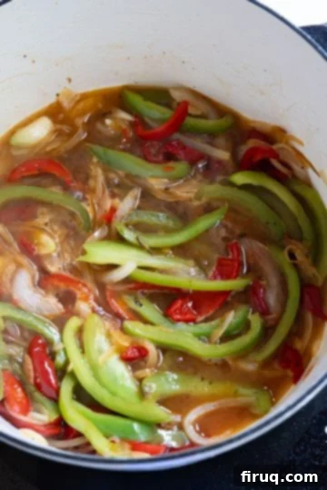 Zesty Italian Chicken Scarpariello 8 peppers and sauce simmering in white wine sauce
