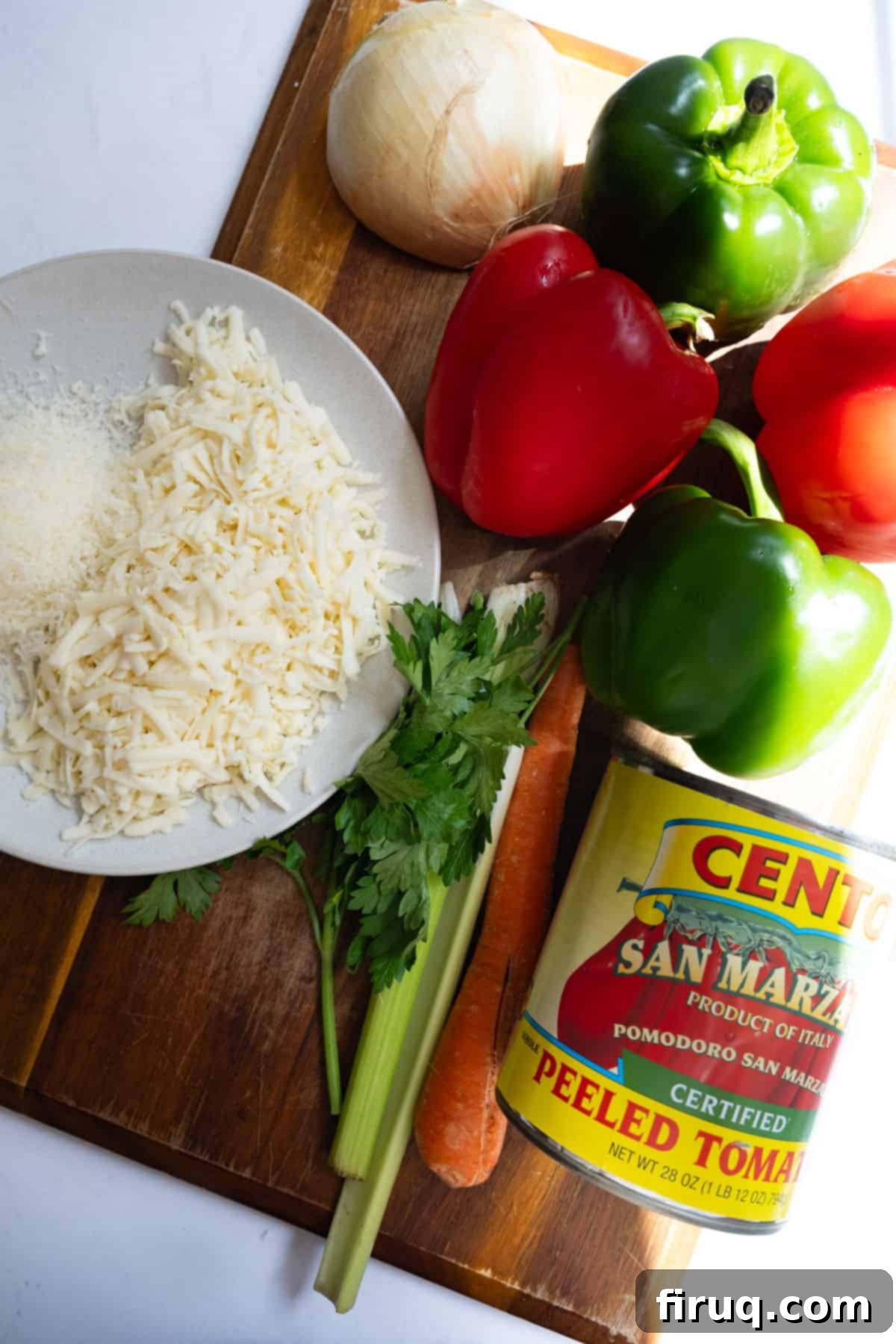 Classic Italian Stuffed Peppers in Tomato Sauce 3 All fresh ingredients for Italian stuffed peppers laid out on a wooden board