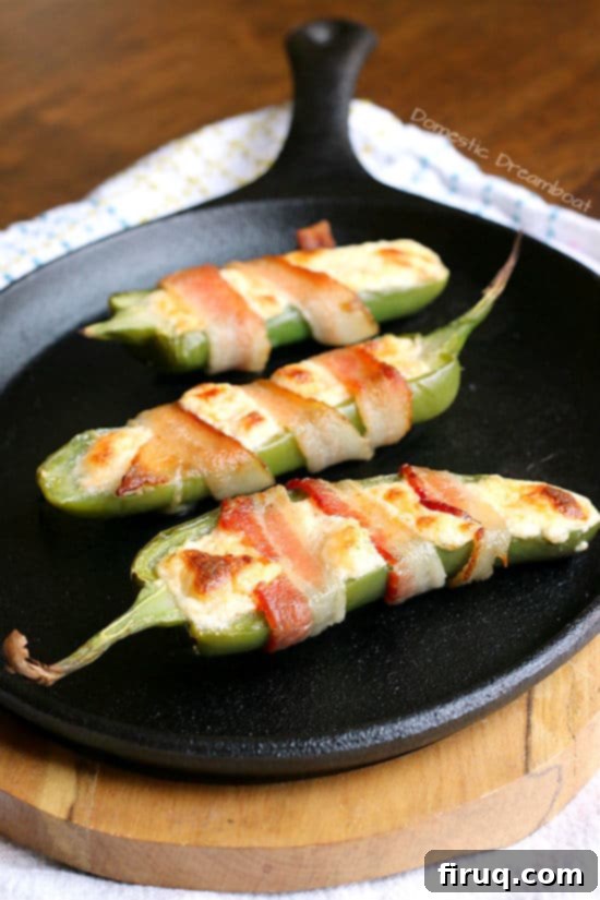 Bacon Wrapped Jalapeno Poppers Appetizer Crispy Bacon Wrapped Jalapeno Poppers, filled with cheese and baked to perfection.