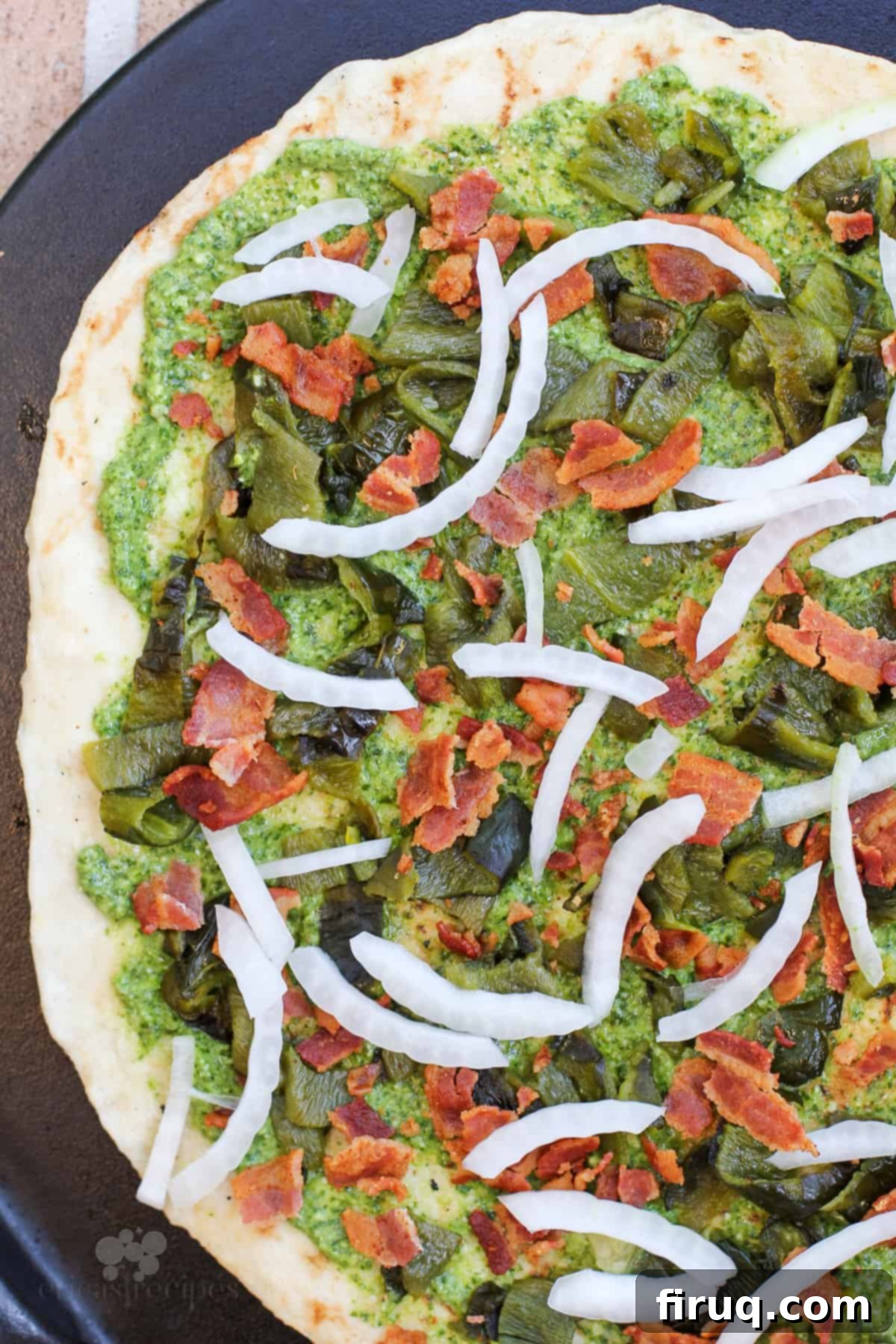 Smoky Roasted Poblano Pizza 5 close-up of pizza toppings including roasted poblanos and mozzarella before baking