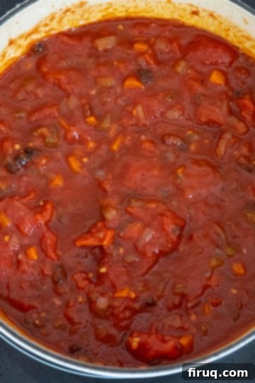 Braised Italian Short Ribs with Gnocchi 8 Red sauce simmering with short ribs partially submerged