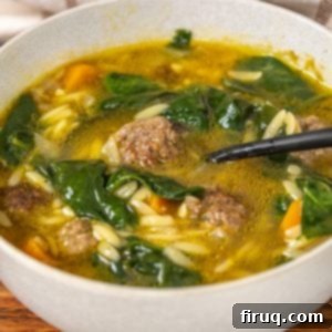 Classic Italian Wedding Soup 9 A comforting bowl of Italian Wedding Soup with mini meatballs, orzo, and spinach, ready to be enjoyed.