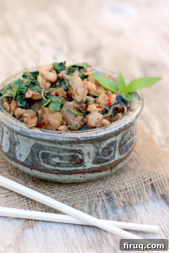 Golden Crispy Oven Baked Chicken Fingers 3 Close up photo of Spicy Thai Basil Chicken in a bowl with chopsticks