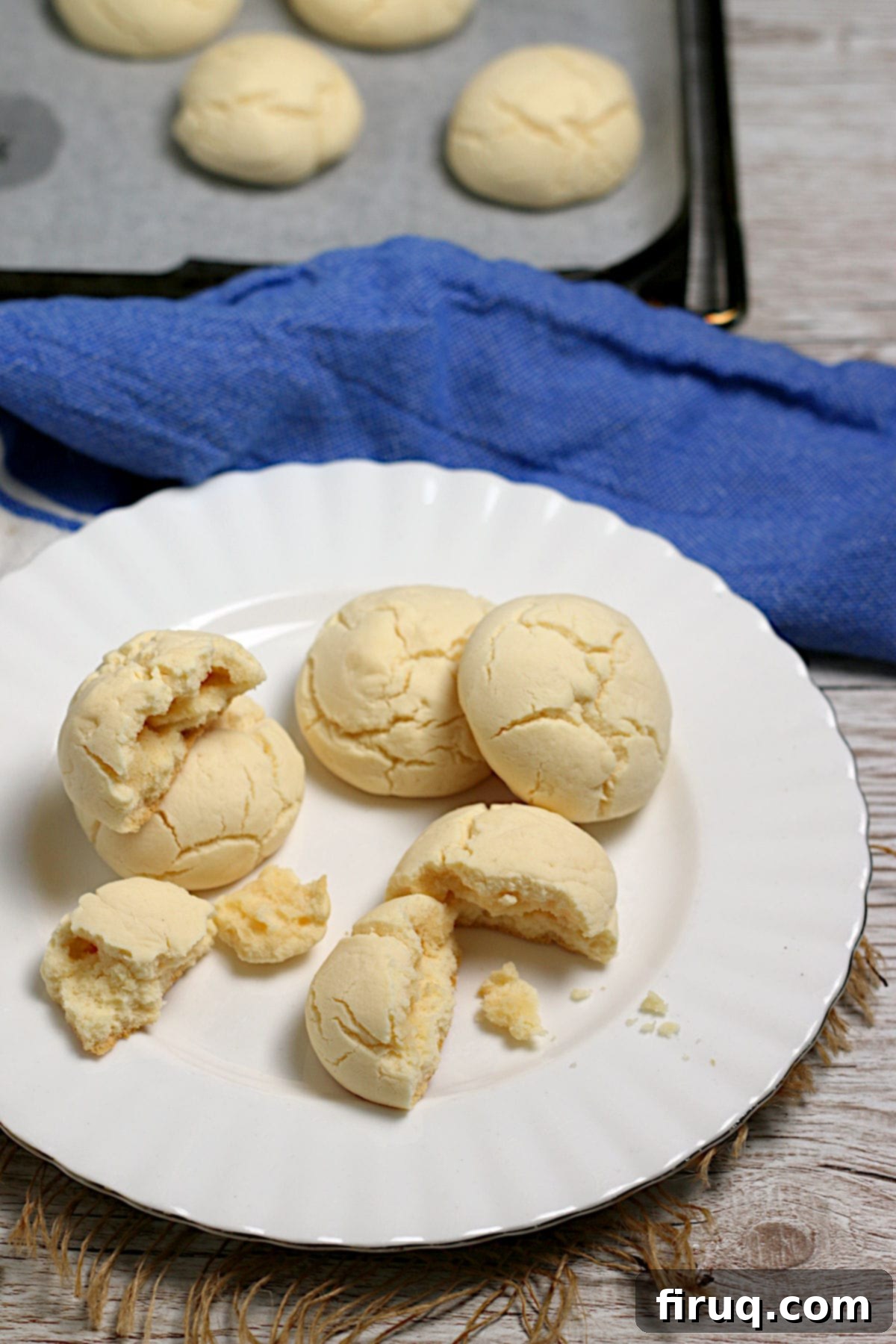 Sequilhos with a cup of coffee Cornstarch cookies (sequilhos) on a white plate.