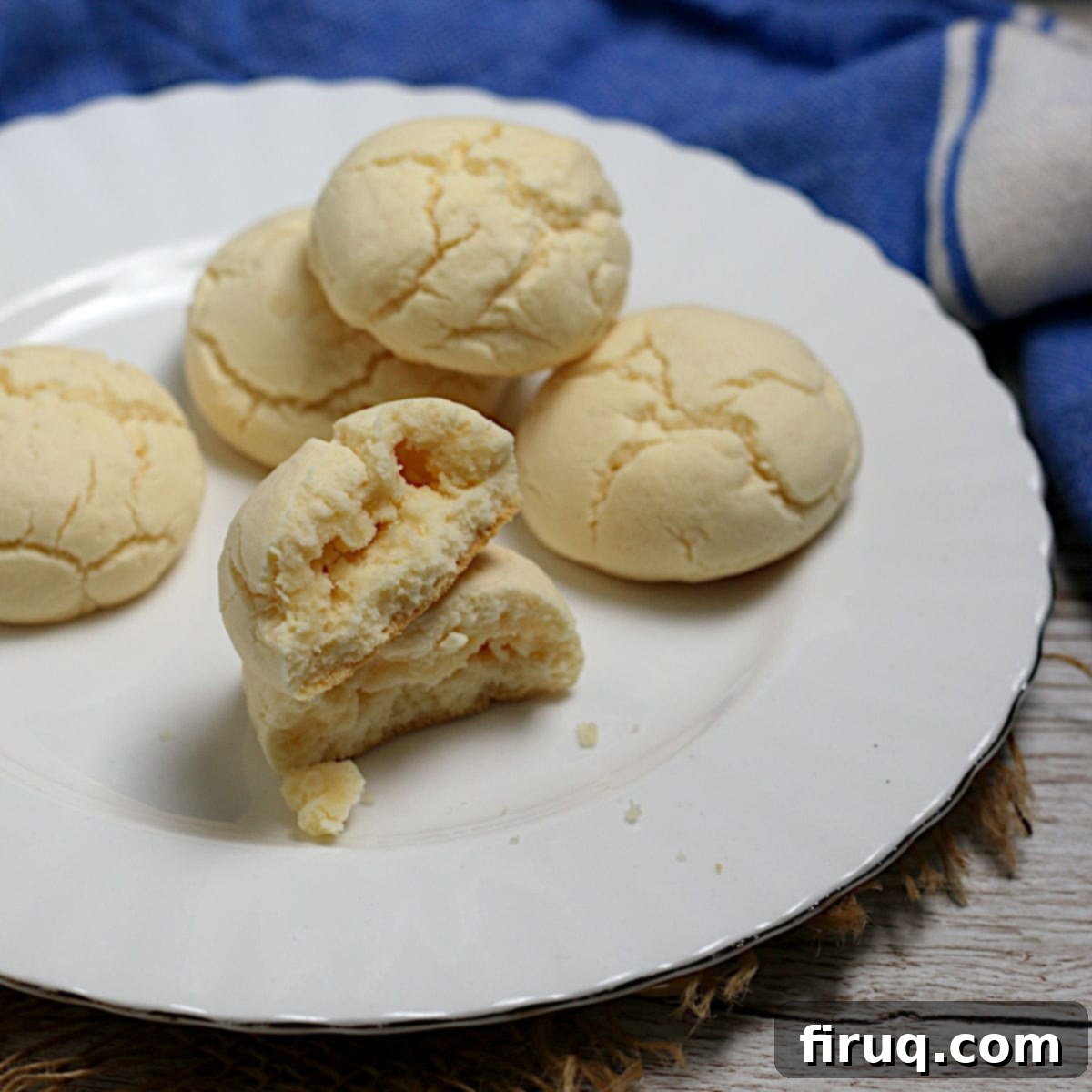 Platter of freshly baked sequilhos Cornstarch cookies (sequilhos) on a white plate.