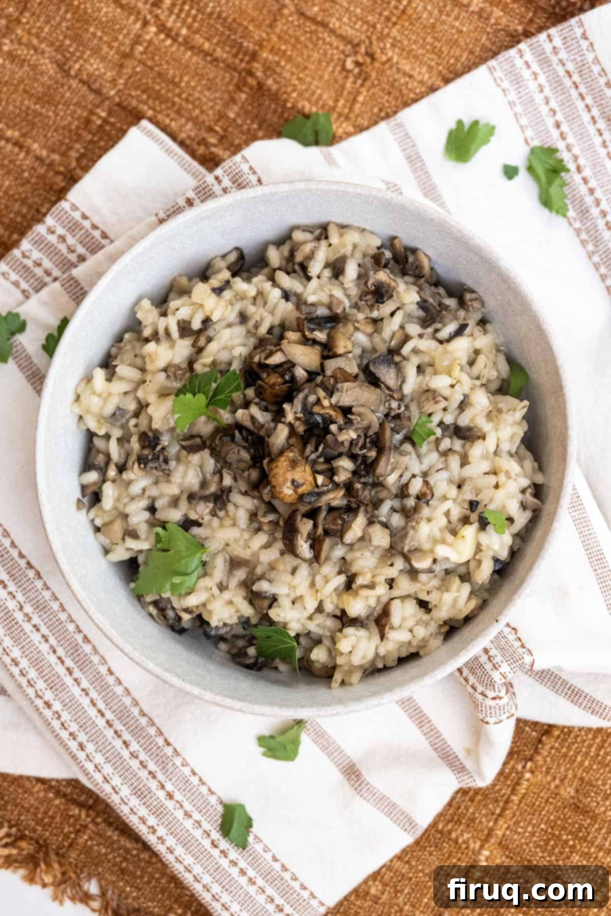 Decadent Mushroom Truffle Risotto 2 A beautifully plated creamy mushroom truffle risotto, garnished with fresh herbs, ready to be served.