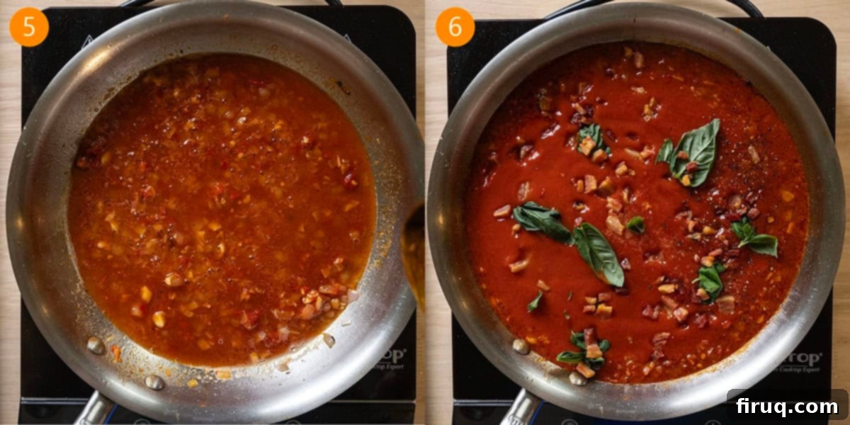 Fiery Vodka Sauce 6 The spicy vodka sauce simmering in a large pan on the stovetop, with a rich red color and creamy texture.