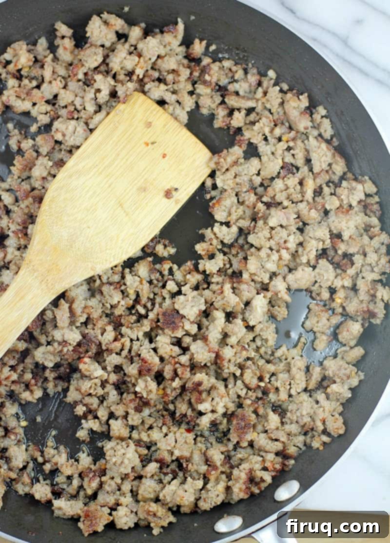 Irresistible Velveeta Rotel Sausage Dip 4 Cooked sausage in the skillet