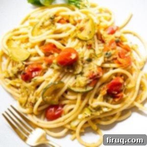 Sun-Kissed Zucchini Pasta 10 Finished Italian Summer Pasta with Zucchini and cherry tomatoes, perfectly tossed and ready to serve, highlighting its creamy, vibrant appeal.
