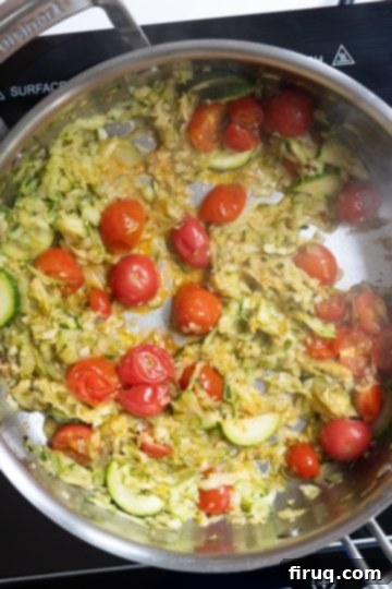 Sun-Kissed Zucchini Pasta 6 A close-up of the zucchini and cherry tomato sauce as it begins to break down, thicken, and meld into a creamy consistency.