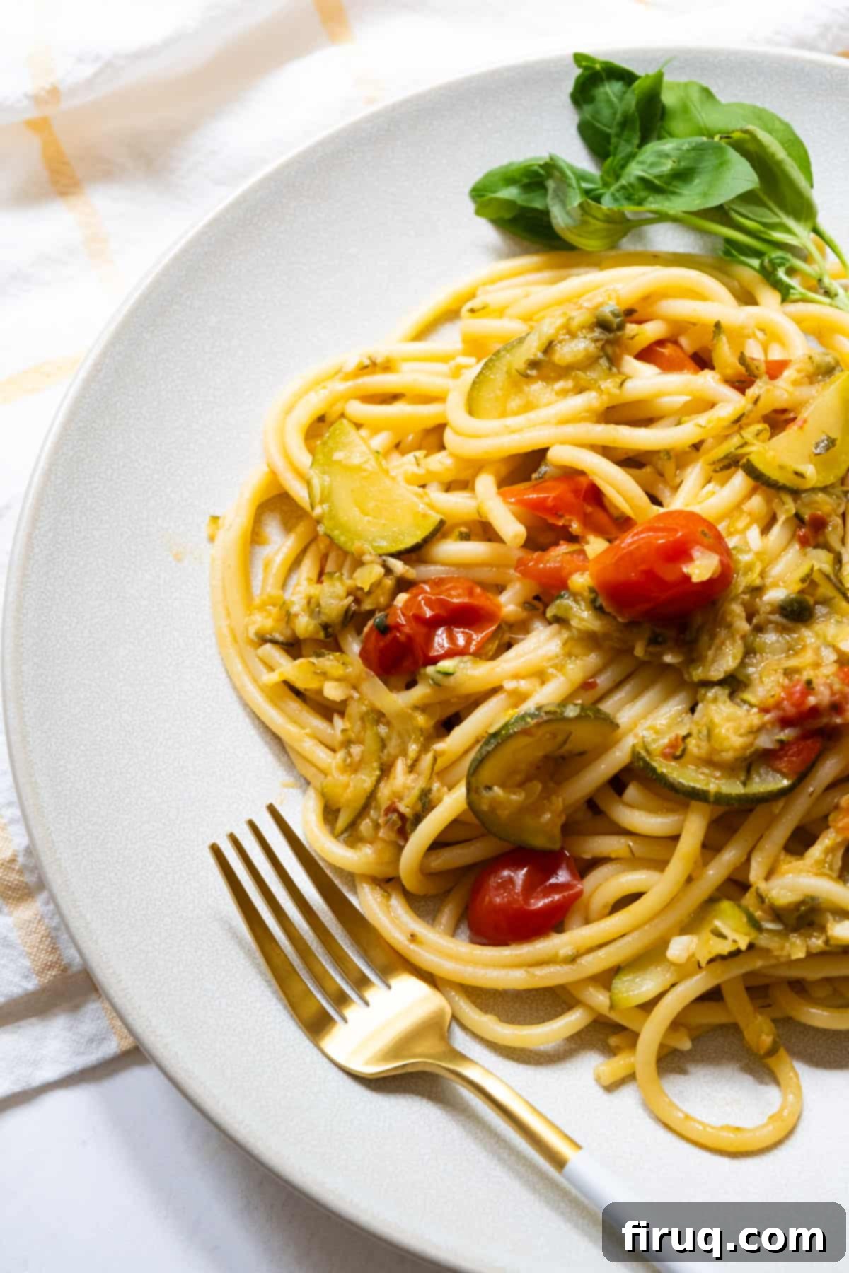 Sun-Kissed Zucchini Pasta 9 The finished dish of Italian summer pasta with zucchini and cherry tomatoes, perfectly plated and ready to be enjoyed. Highlighted by fresh herbs and a glossy sauce.