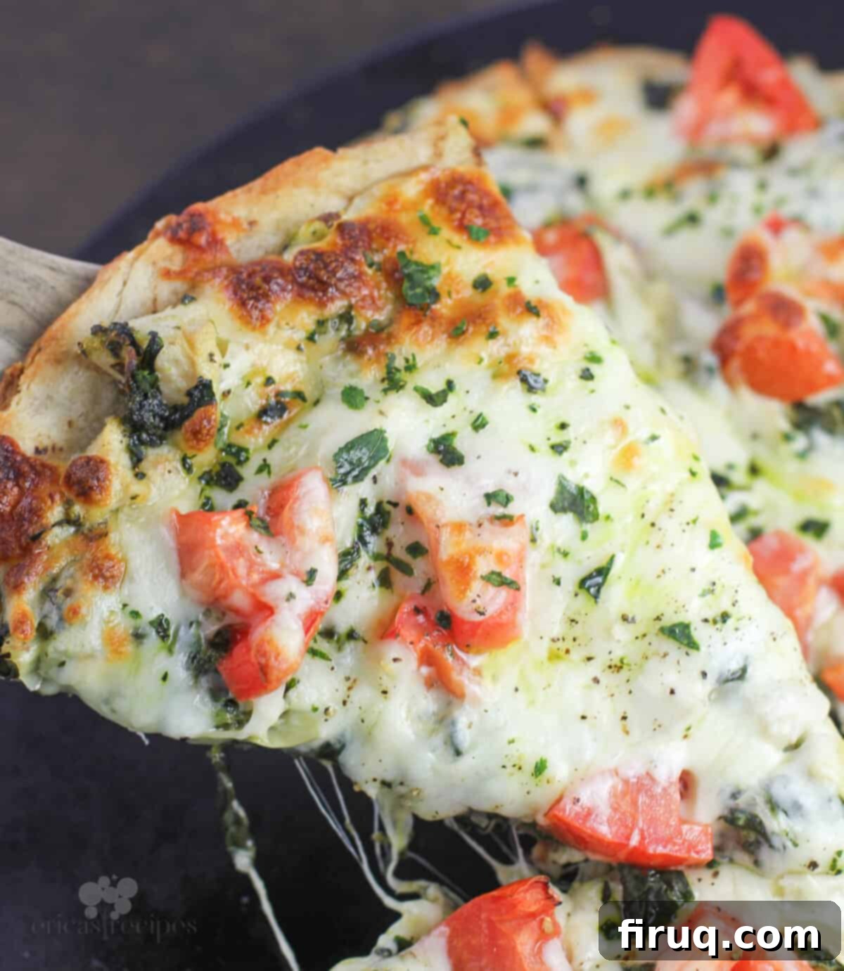Creamy Spinach Artichoke Indulgence 7 wood spatula lifting slice of pizza