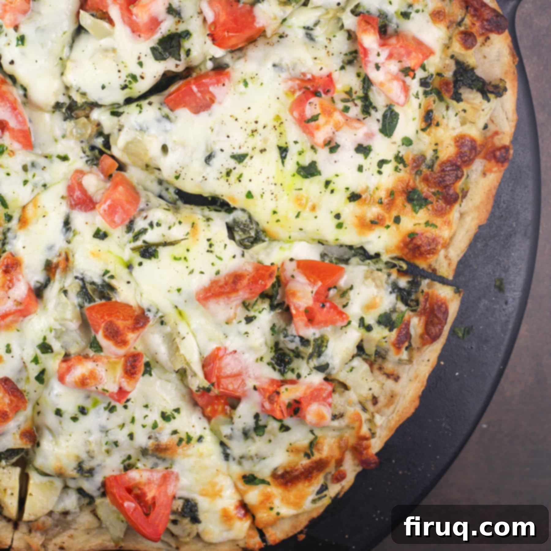 Creamy Spinach Artichoke Indulgence 9 spinach artichoke pizza on pizza stone