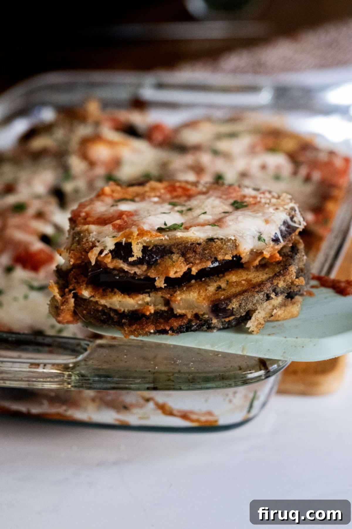 The Ultimate Homemade Eggplant Parmigiana 2 Classic homemade eggplant parmigiana with melted cheese and rich sauce