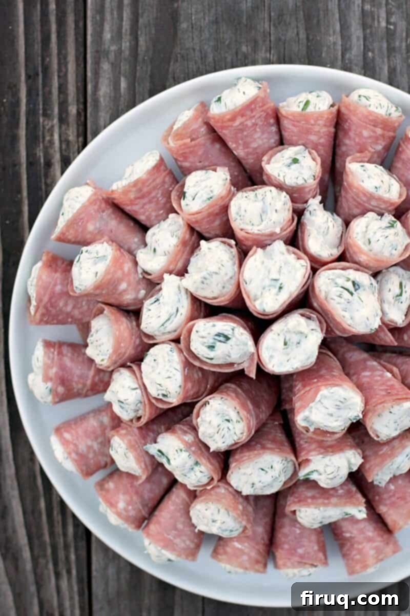 Creamy Cornucopia Salami Rolls 2 salami cornucopia on a plate on wood