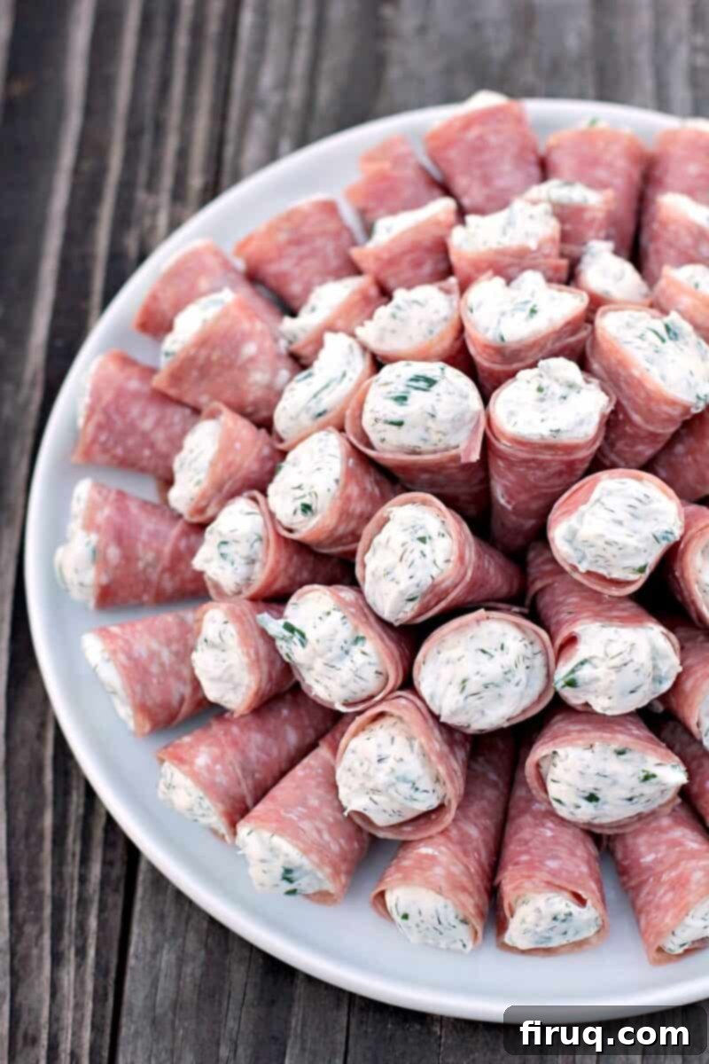 Creamy Cornucopia Salami Rolls 8 salami rollup on a white plate
