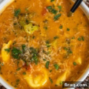 Hearty Italian Sausage and Tortellini Soup 12 rustic italian tortellini soup topped with parmesan