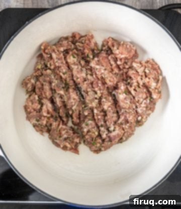 Hearty Italian Sausage and Tortellini Soup 3 searing sausage in a patty