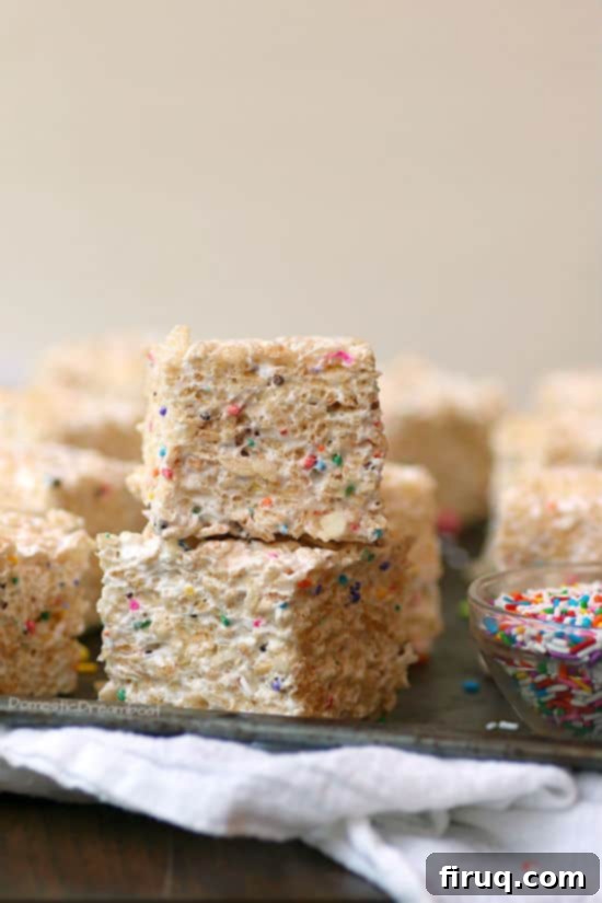 Funfetti Rice Krispie Squares Homemade Marshmallow Rice Krispie Squares with colorful sprinkles.