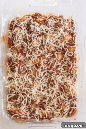 Hearty Stuffed Shells with Bolognese and Ricotta 11 topping the meat sauce with mozzarella