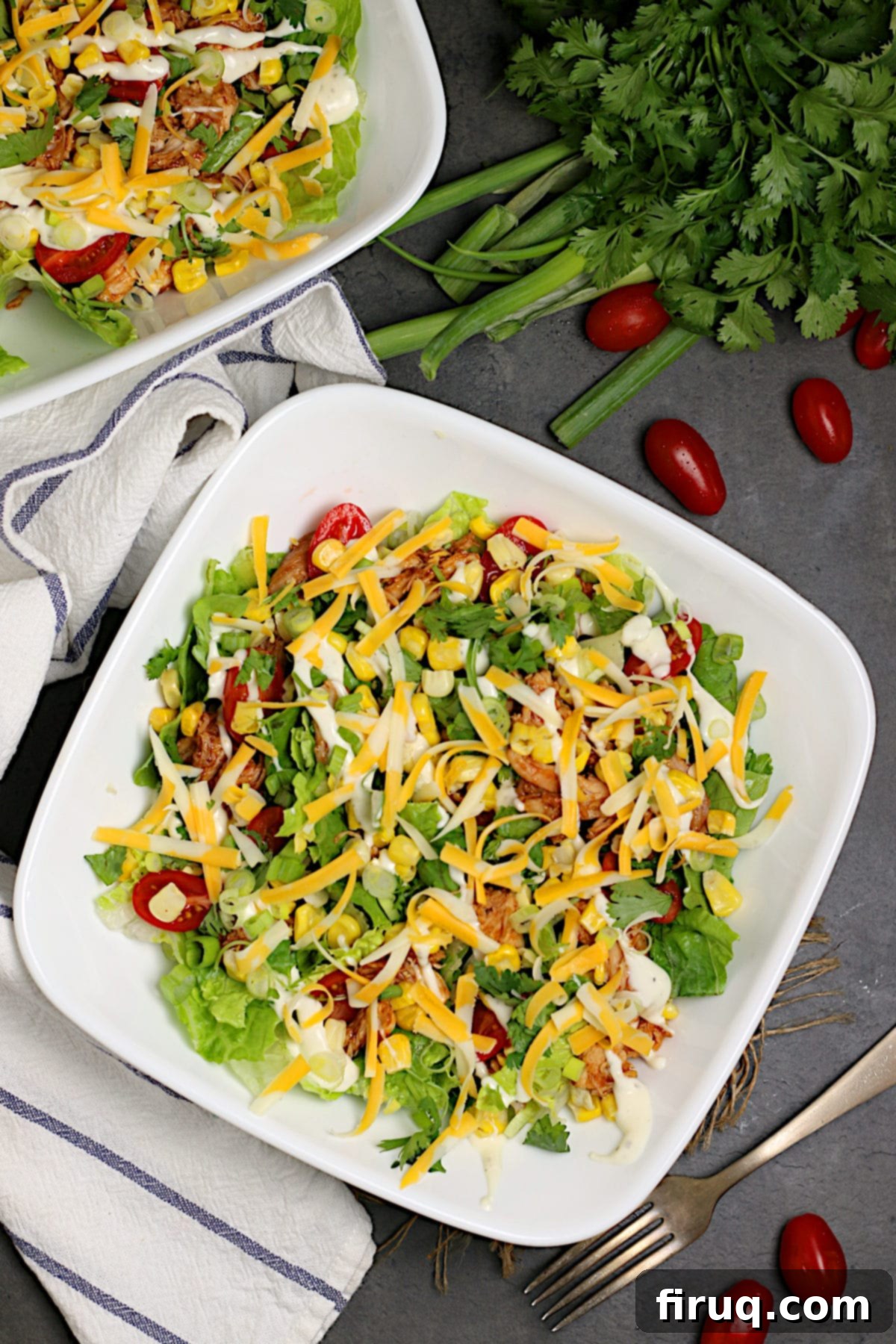Fresh Ingredients for BBQ Chicken Ranch Salad Two white bowls filled with Barbecue Chicken Ranch Salad, ready to be served.