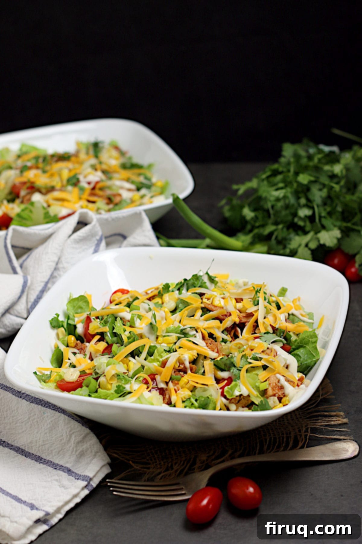 Customizable BBQ Chicken Ranch Salad A delicious Barbecue Chicken Ranch Salad in a white bowl, showing all its vibrant ingredients.