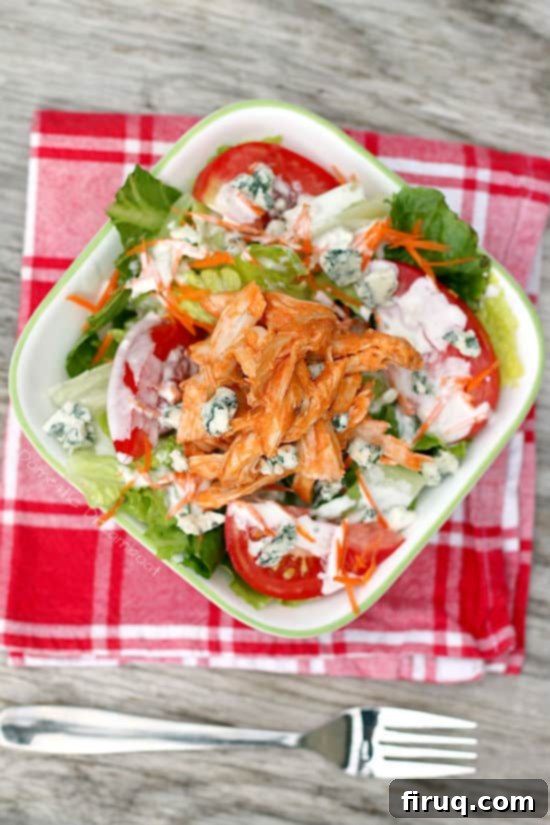Buffalo Chicken Salad Buffalo Chicken Salad with Blue Cheese Dressing in a white bowl.