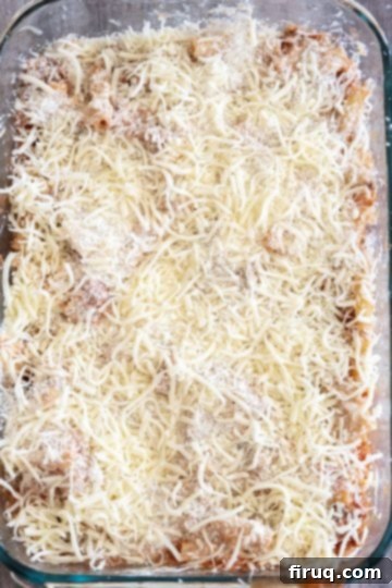 Homestyle Italian Baked Ziti 10 another layer of everything added to the baking dish topped with extra parmesan and mozzarella
