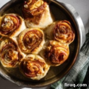 Savory Pepperoni Spiral 9 Delicious completed pepperoni stromboli, golden and crispy.