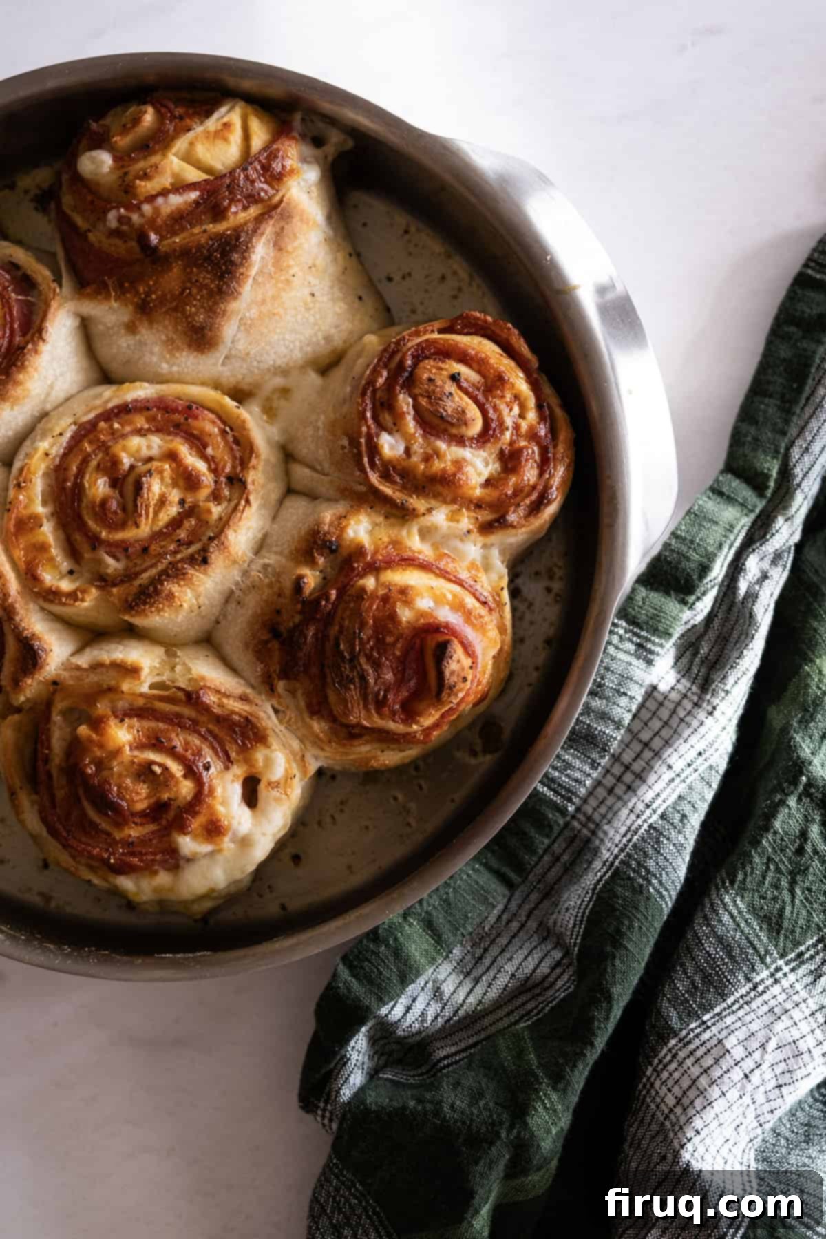Savory Pepperoni Spiral 7 Perfectly baked pepperoni bread (stromboli) with a golden-brown crust, displayed on a wooden cutting board.
