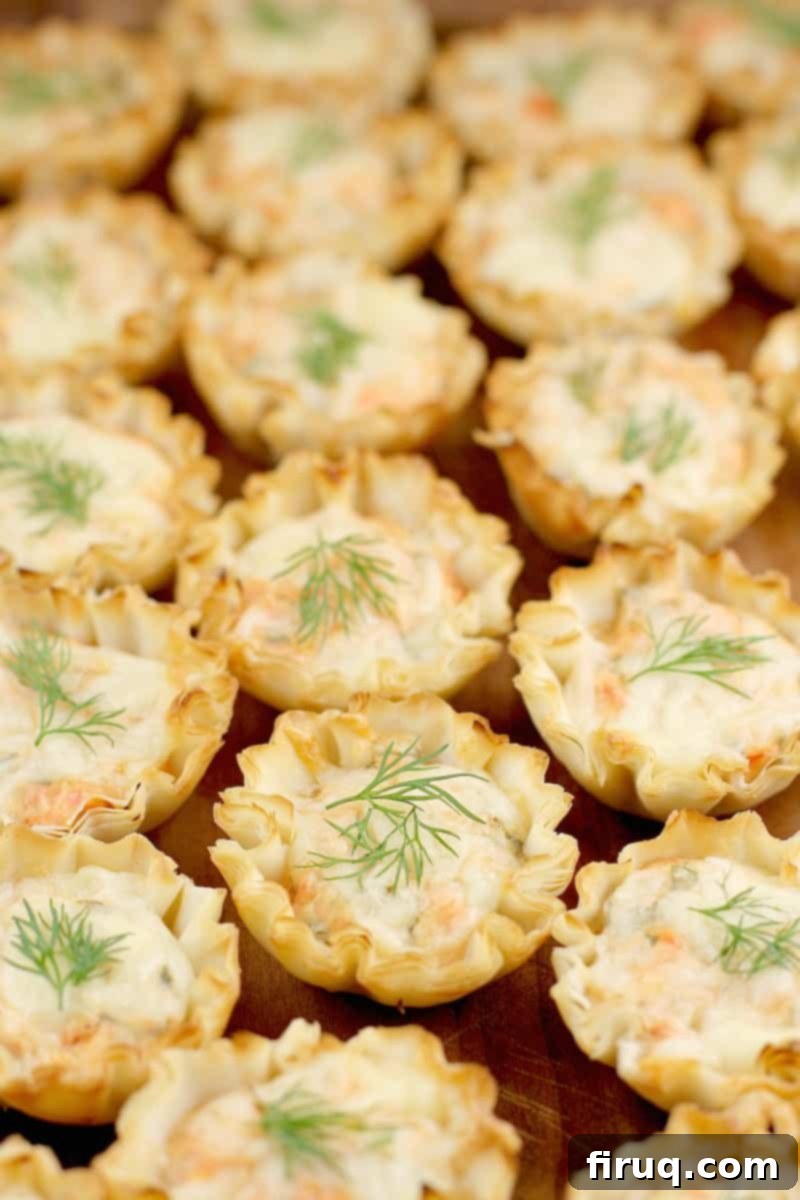 Exquisite Smoked Salmon Tartlets 2 side view of a finished cold smoked salmon appetizer on a wood tray