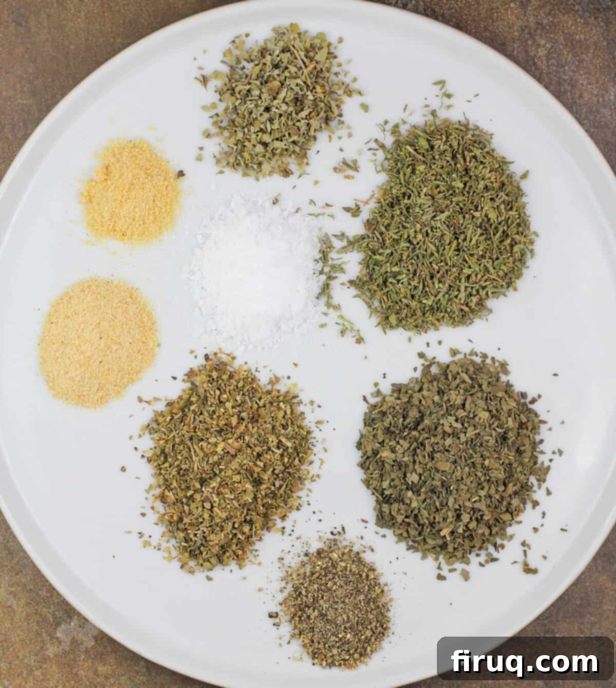 Restaurant Secret Olive Oil Bread Dip 4 white plate showing the ingredients beofre mixing