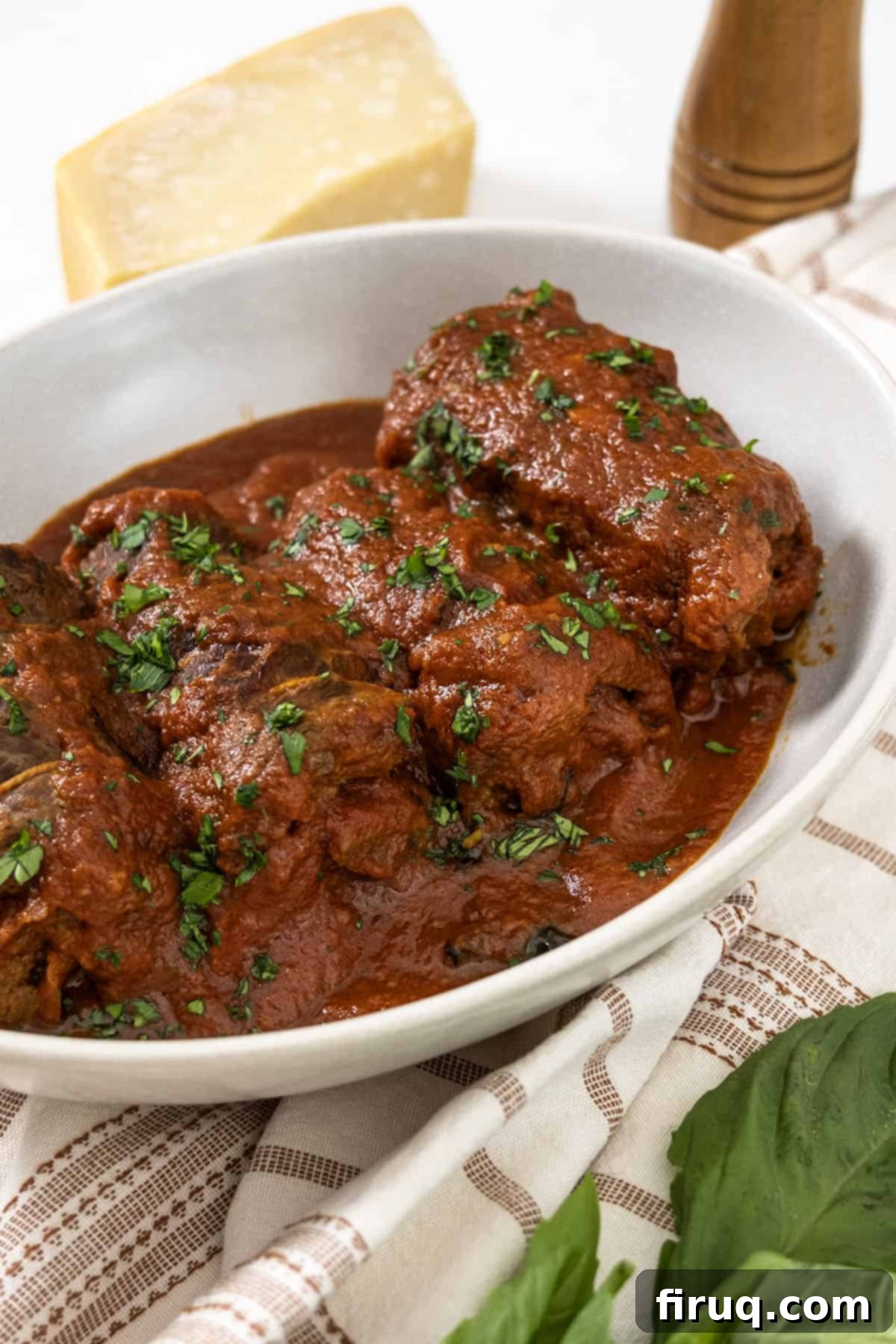Slow-Simmered Italian Braciole Perfection 2 Italian braciole garnished with fresh parsley, served in a rich tomato sauce