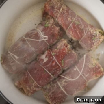Slow-Simmered Italian Braciole Perfection 8 Searing the bracioles in a hot pan with olive oil