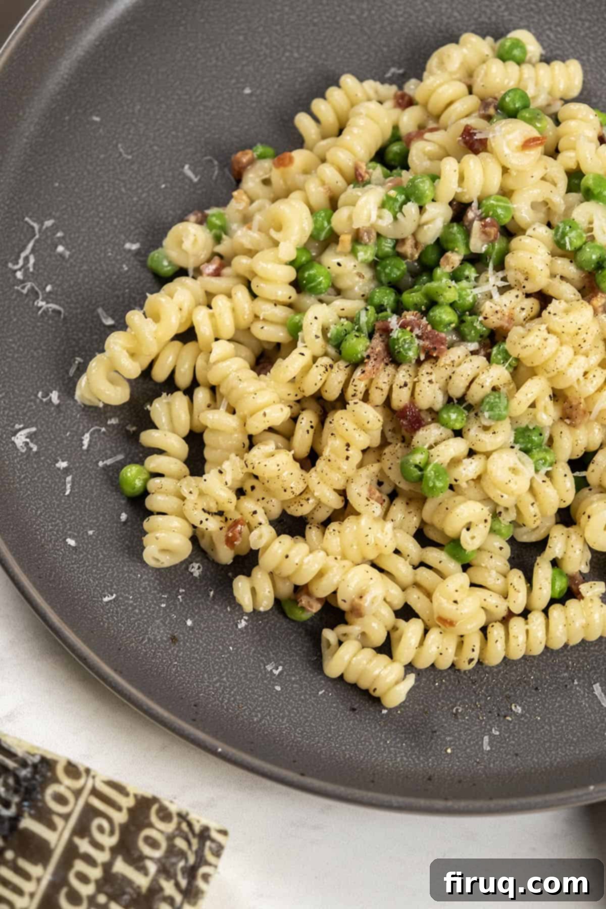 Pea and Pancetta Pasta 2 Delicious and creamy pasta with peas and pancetta, garnished with fresh herbs and cheese.