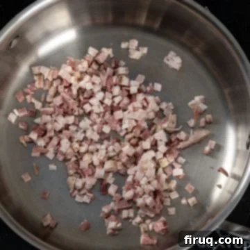 Pea and Pancetta Pasta 3 Pancetta cubes placed in a cold pan, ready to be rendered.
