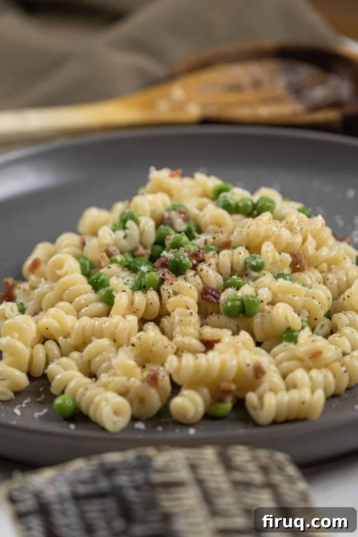 Pea and Pancetta Pasta 8 Close-up shot of creamy pasta with peas and pancetta, ready to be served.
