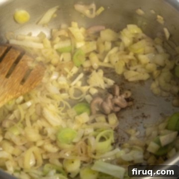 Crimson Wine Fennel Chicken Thighs 5 Garlic and anchovy paste being added to softened leeks and fennel in a pan, ready for the red wine.