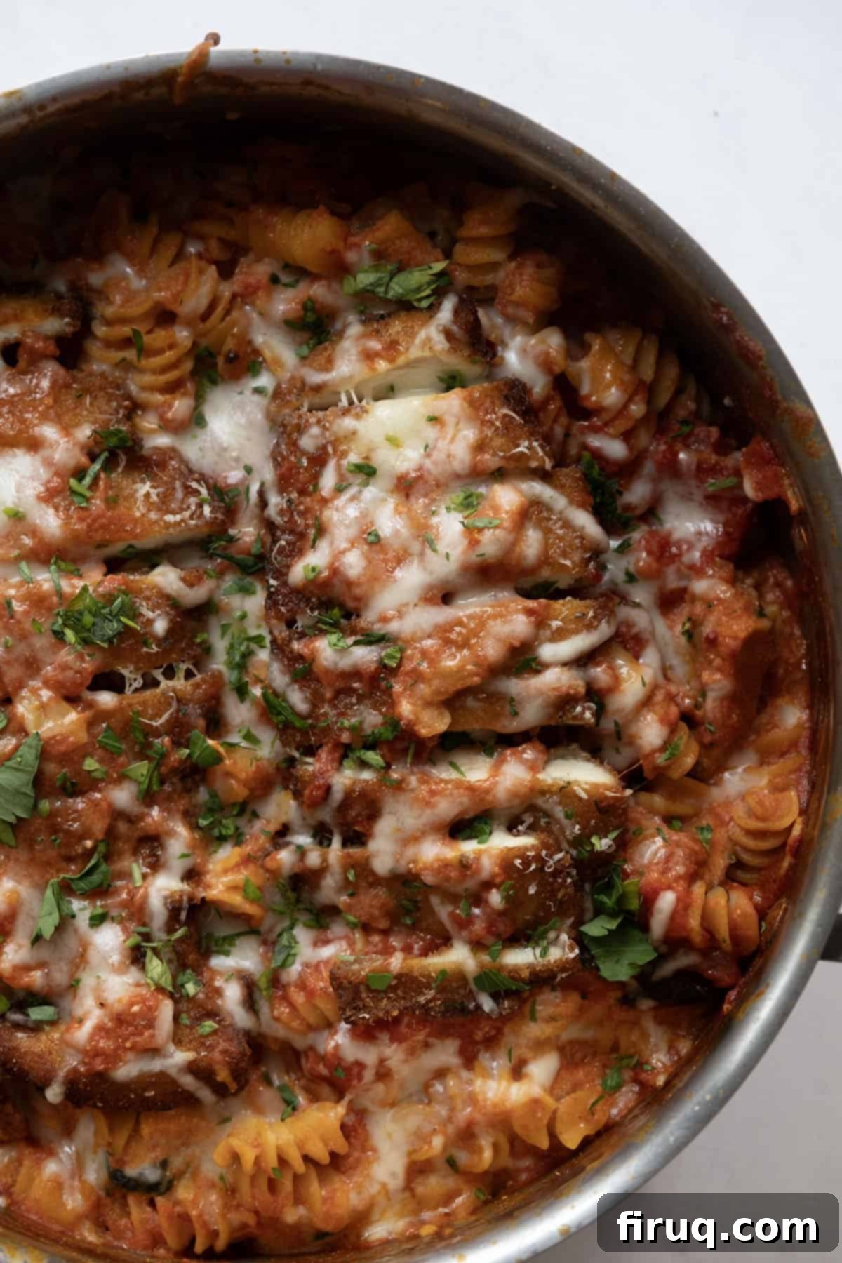 Dreamy Creamy Chicken Parmesan Pasta 2 creamy chicken parmesan pasta in a skillet