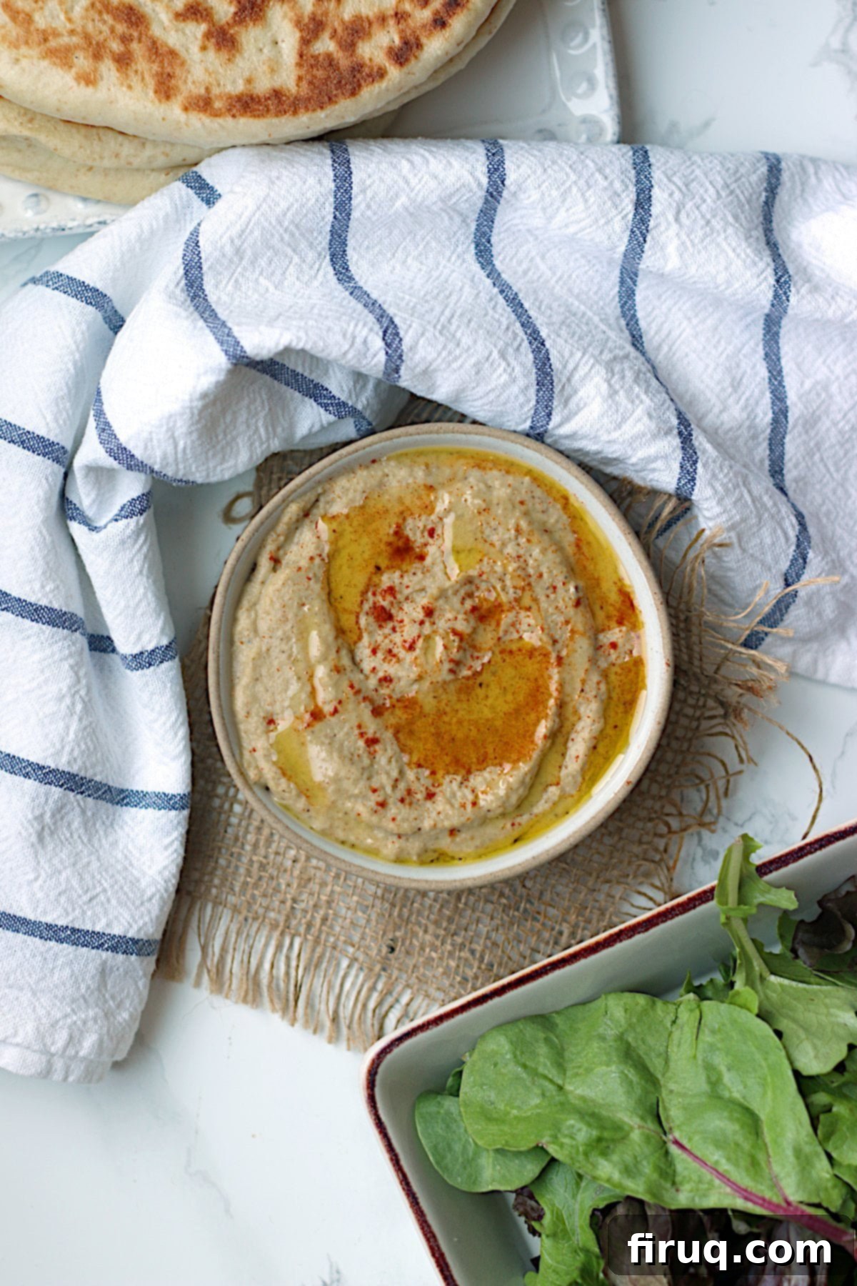 Serving Baba Ghanouj An overhead photo of a bowl of homemade baba ghanouj, garnished and ready to serve.