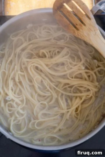 Coastal Linguine with Tender Clams 7 pasta finishing in the pan with clam sauce