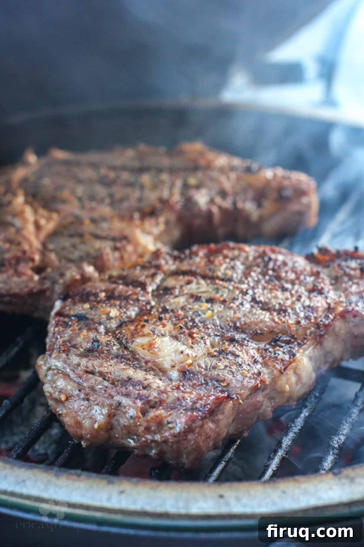 Grilled Steak with Zesty Horseradish Dijon 7 A thick steak cooking over direct flame on a hot grill, showing excellent char marks.