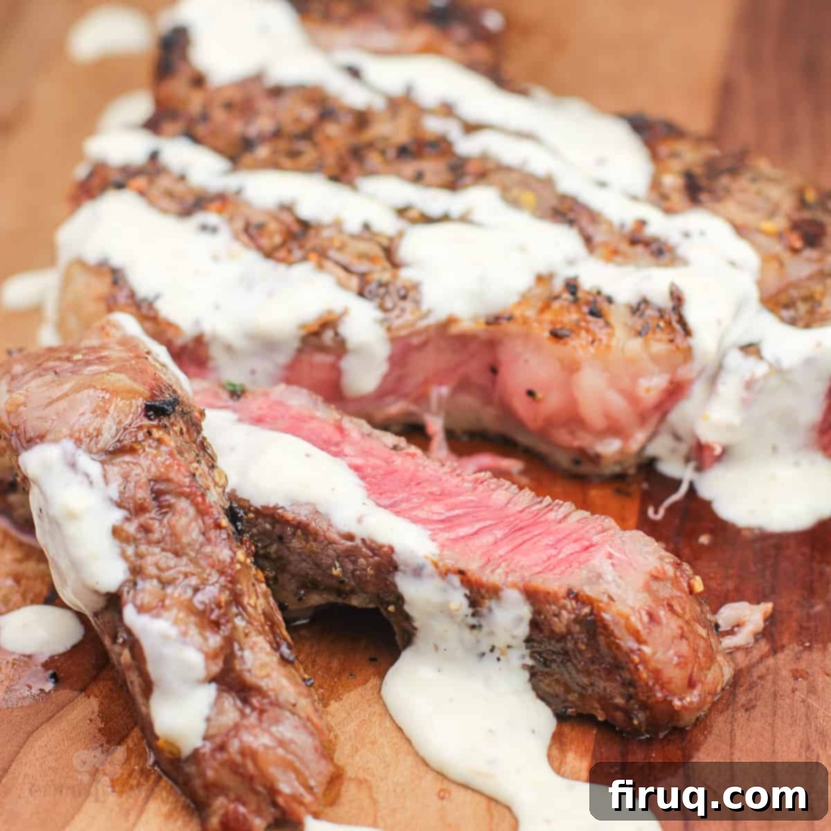 Grilled Steak with Zesty Horseradish Dijon 9 grilled steak on wood board topped with horseradish dijon sauce