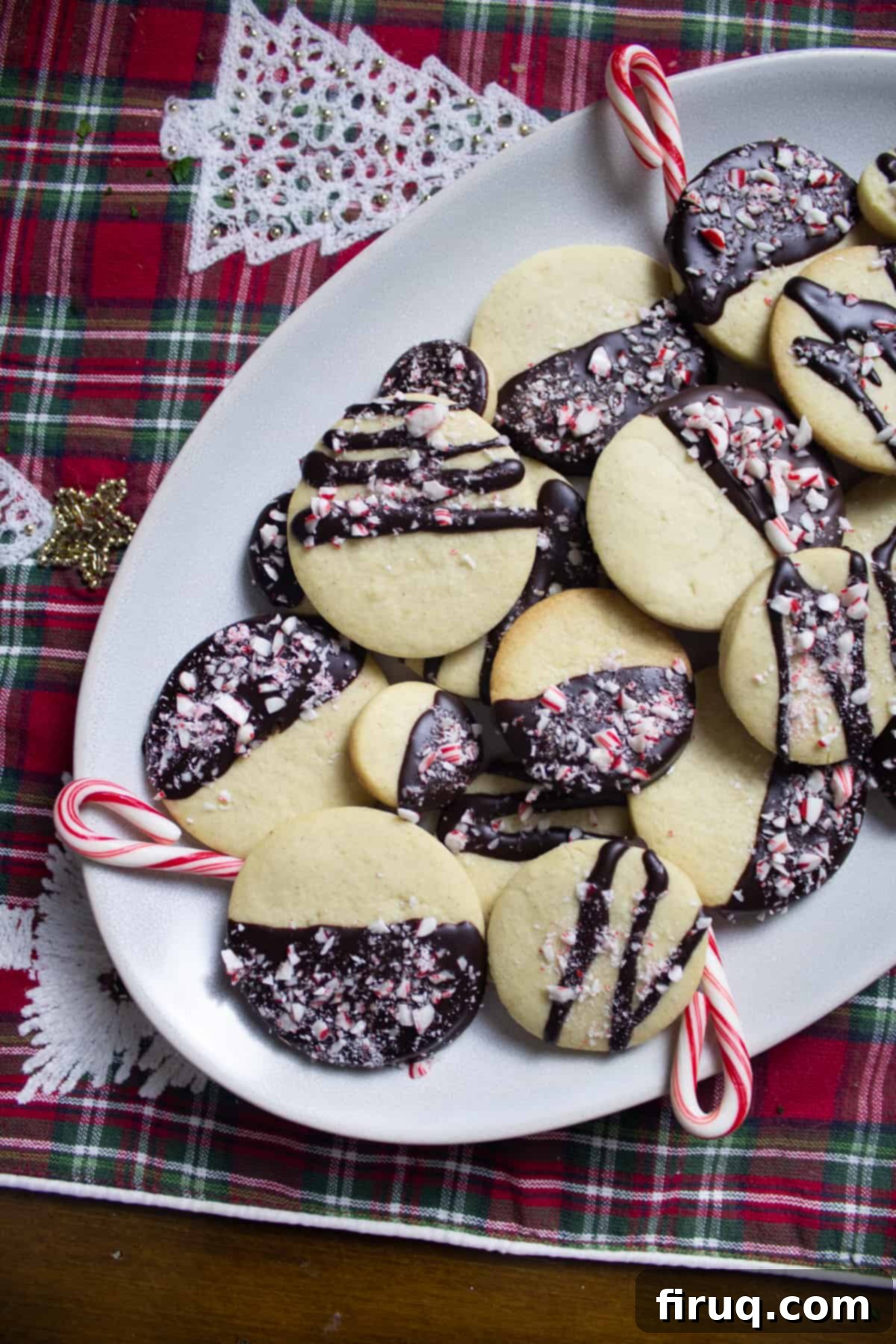 Decadent Dark Chocolate Peppermint Sugar Cookies 2 dark chocolate half dipped sugar cookies with candy cane crumbles