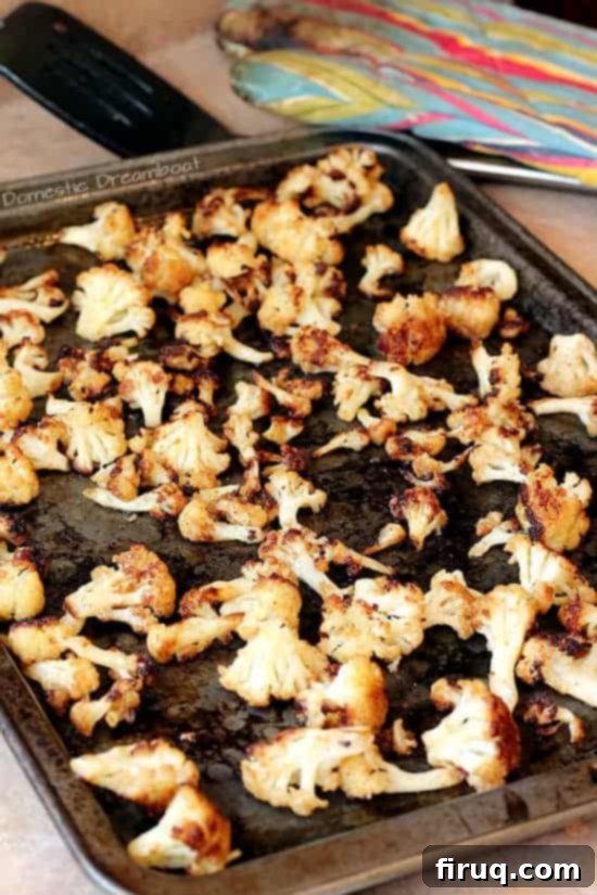 Golden Crispy Roasted Cauliflower Crispy Roasted Cauliflower on a baking pan.