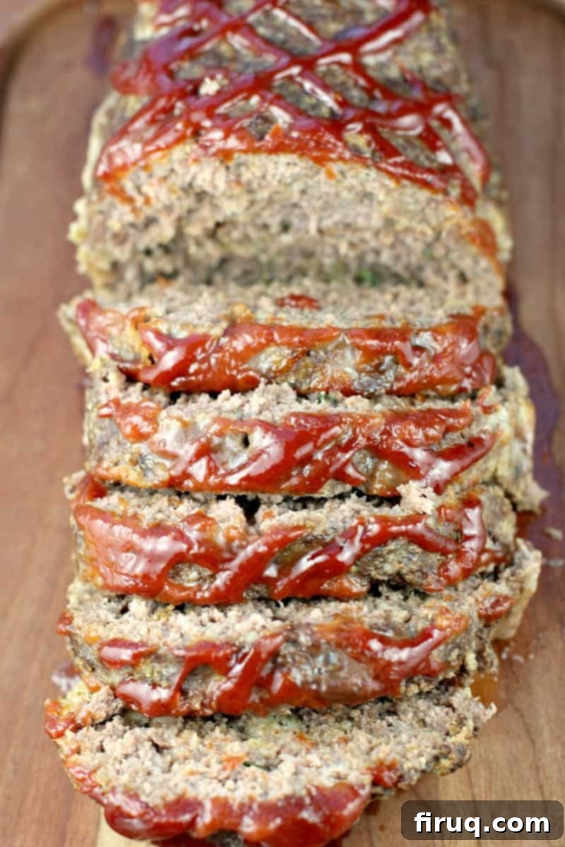 Mom's Meatloaf 10 view of the sliced best meatloaf ever angled to show the ketchup and barbecue sauce on top