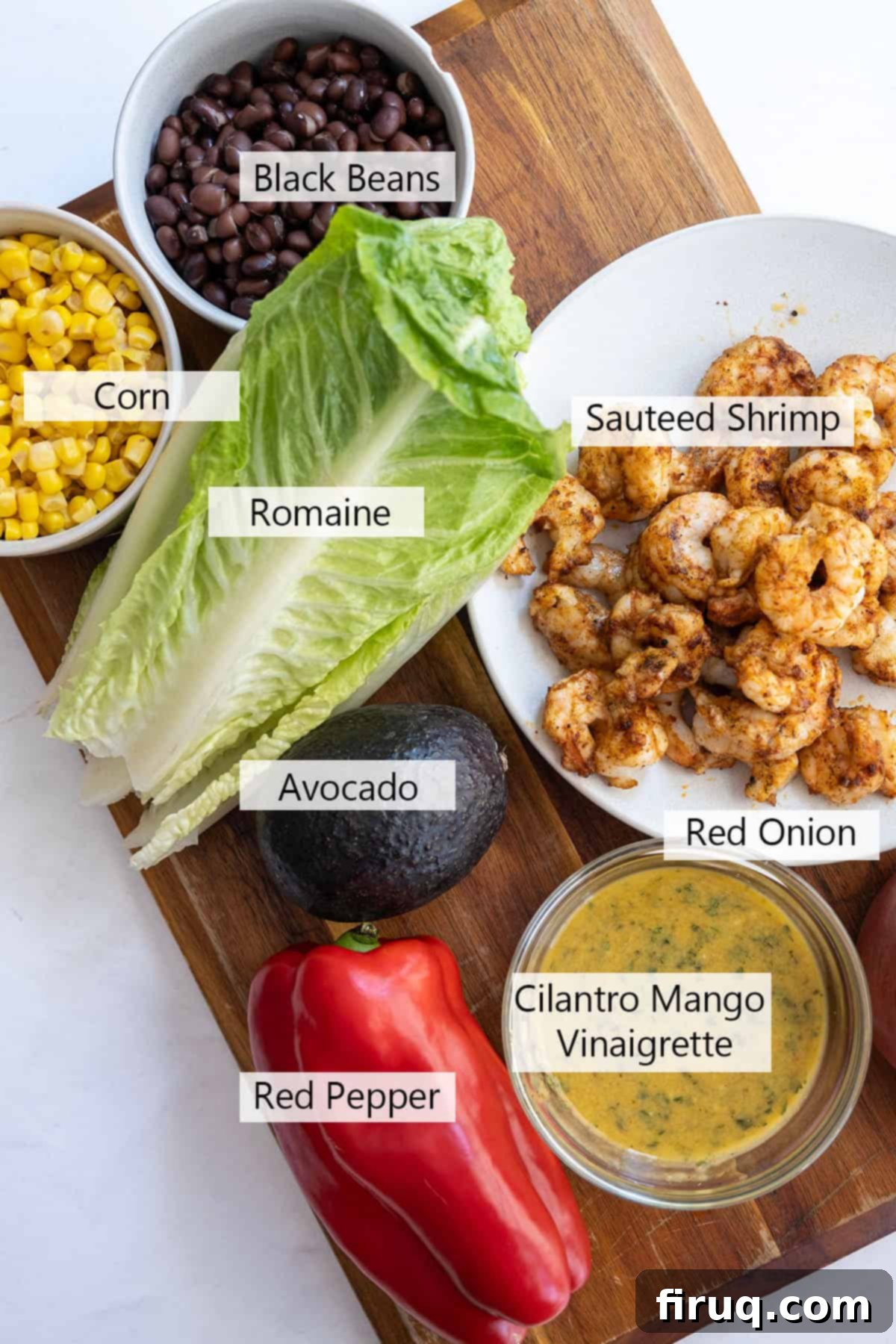 Zesty Mango-Lime Grilled Shrimp Salad 3 Ingredients laid out for the grilled shrimp salad, including mango, lime, shrimp, and vegetables.