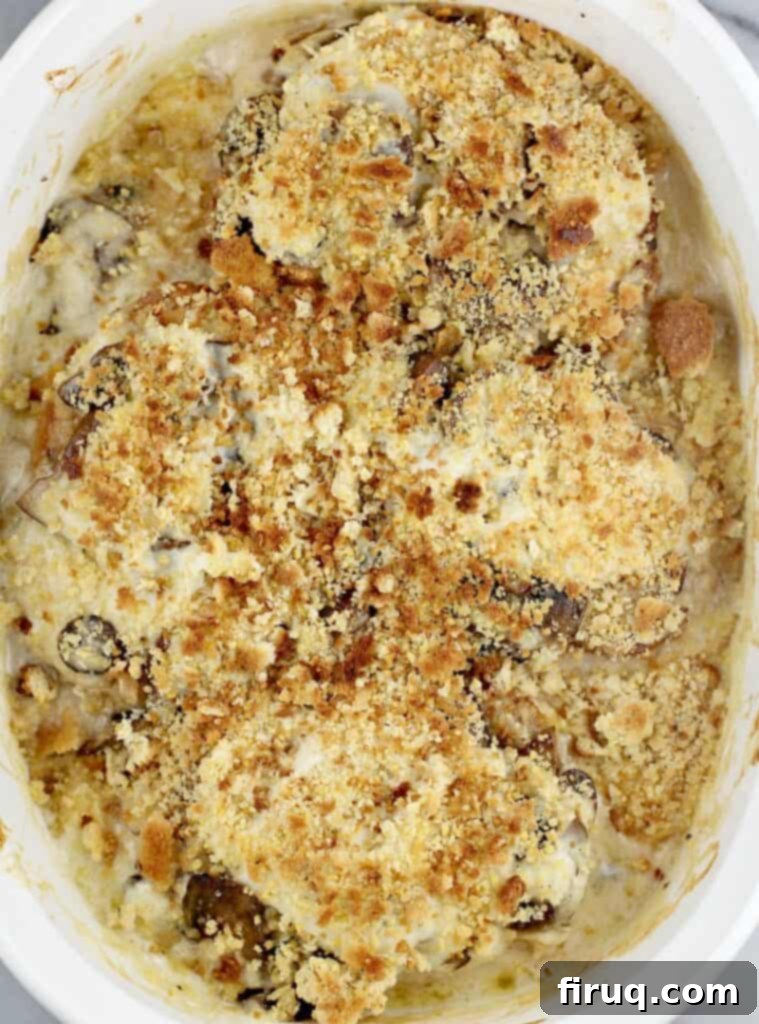 Hearty Pork Chop and Cornbread Bake 11 top view of cooked casserole to show the lightly browned cornbread stuffing topping