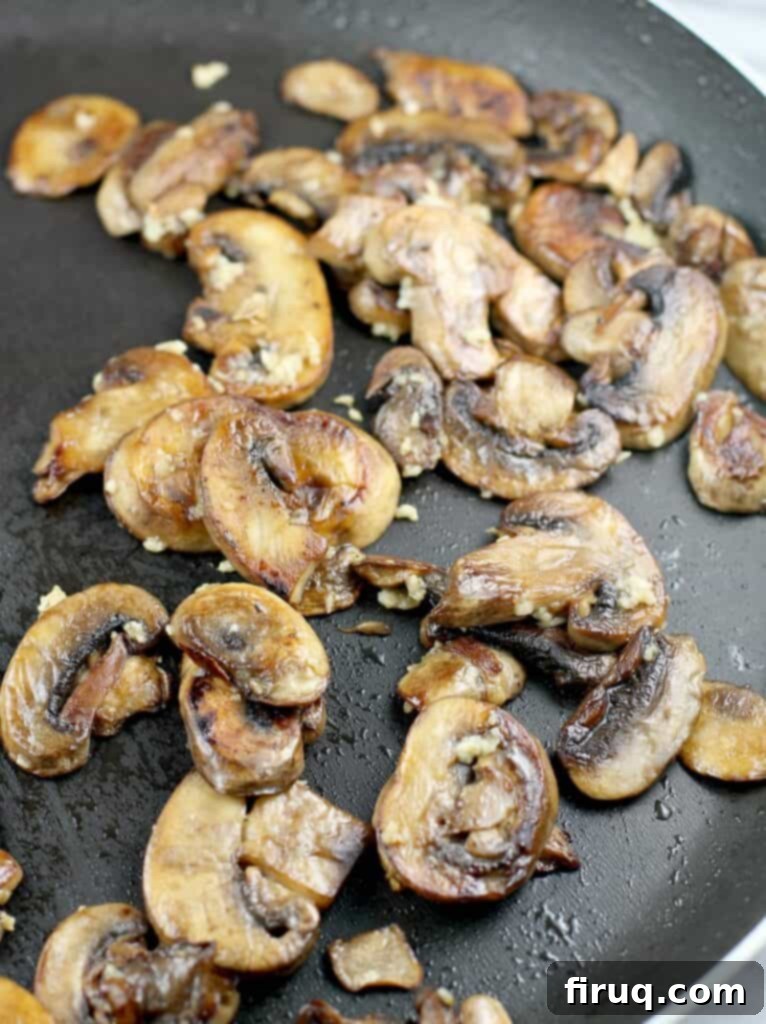 Hearty Pork Chop and Cornbread Bake 7 browned mushrooms in a skillet